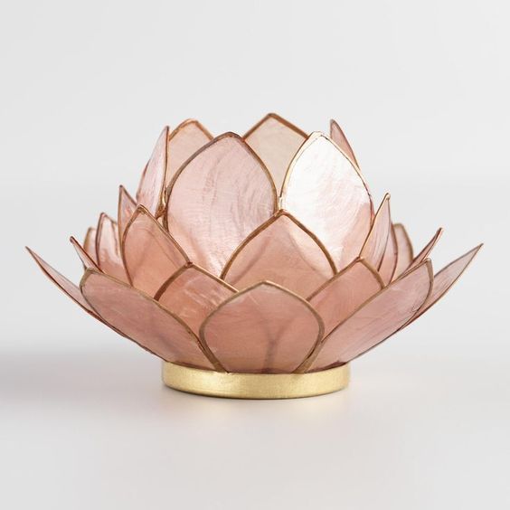a pink lotus-inspired table lamp with a gold edge is very chic and very refined, it will give a natural feel to your space