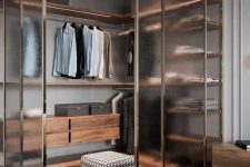 a modern walk-in closet with paneled walls