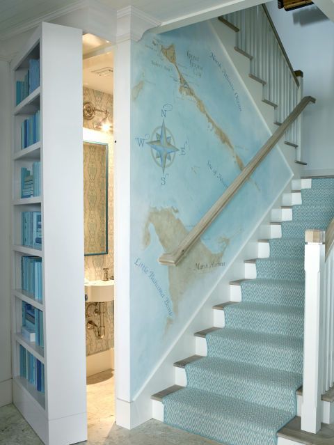 a seaside staircase covered with light blue printed carpet covering the steps is a pretty and easy idea to realize