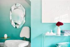 an ombre wall from white to turquoise with an alcove is a bold decoration idea to try