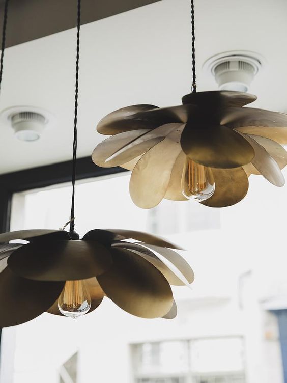 statement pendant lamps with large petals will bring a natural feel to any modern space without looking too whimsy