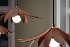 veneer lotus pendant lamps in a rich tone of wood are a chic addition to a modern interior