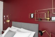 a burgundy statement wall is a bold idea for a bedroom and it’s actual not only in the fall