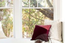a color block burgundy, coral and purple pillow for adding a slight fall touch to the space