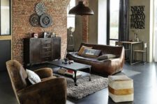 a cozy industrial space done with leather furniture, a brick statement wall, a furry rug and a metal coffee table