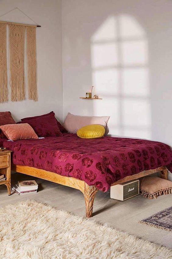 a printed burgundy blanket and pillows are right what you need for a fall bedroom