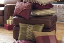 a stack of refined fall colored pillows – neutral, burgundy and plaid and embellished for the fall