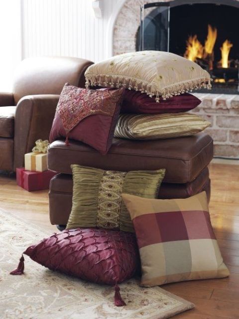a stack of refined fall colored pillows - neutral, burgundy and plaid and embellished for the fall