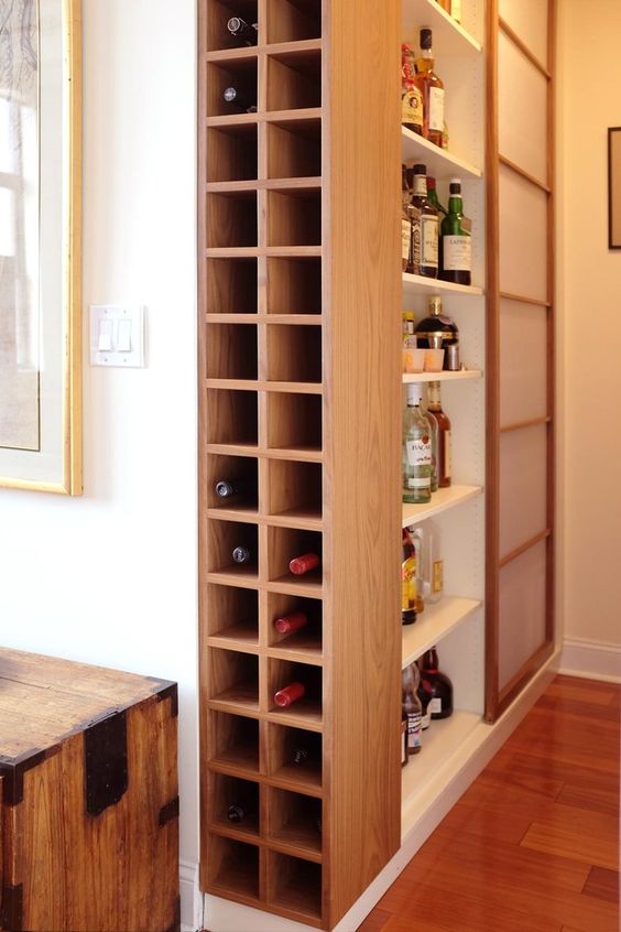 A built in minimalist plywood shelf somewhere on the corner is a smart idea for storing your wine bottles