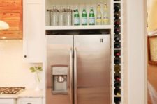 a vertical wine shelf built in between the wall and the fridge will save your space