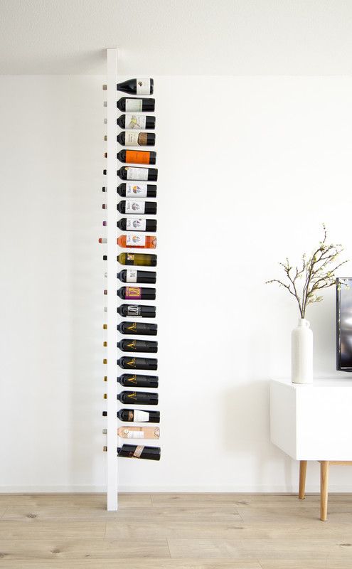 a white vertical rack for wine bottles is very cool and won't take much space in your dwelling