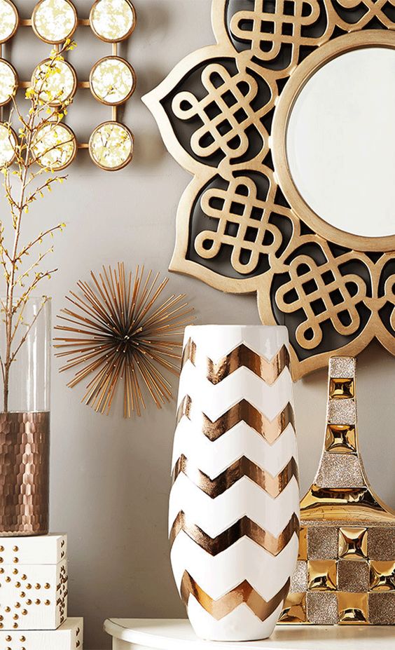 Glam gold and brass decor   vases, a mirror in an ornated frame, a sign and others will be amazing for styling your space