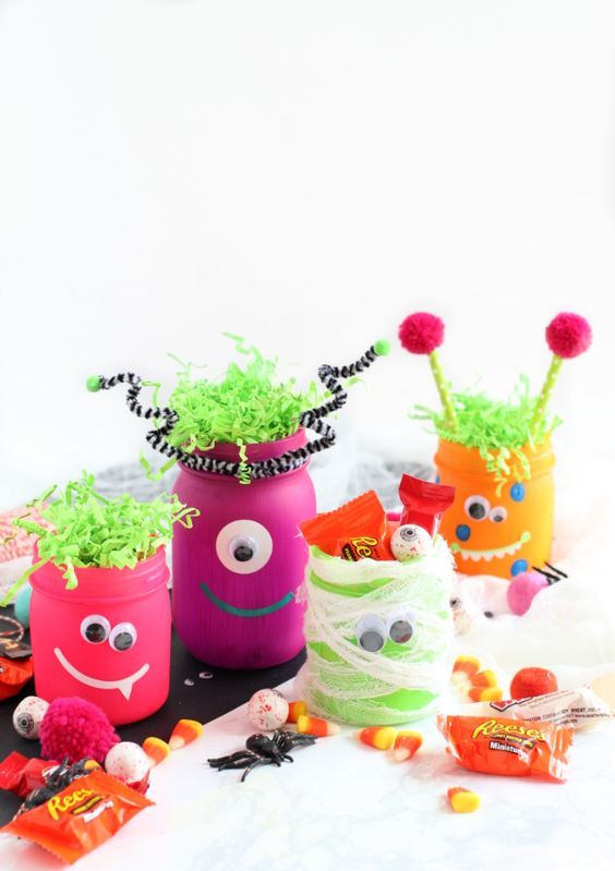 neon monster jars with googly eyes are amazing for kids' Halloween parties and you can DIY them