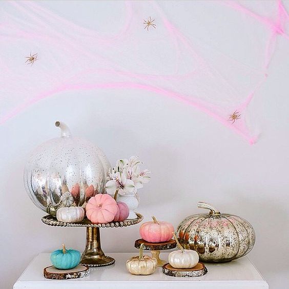 pink spiderweb with gold spiders, mercury glass and pink pumpkins for non-traditional Halloween decor