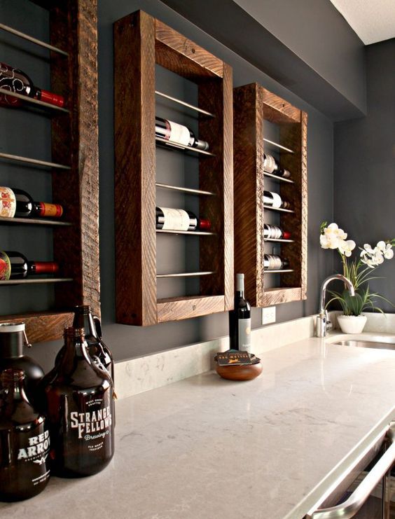 Wall mounted framed wooden shelves for wine bottles will give a rustic feel and a stylish look to your home bar