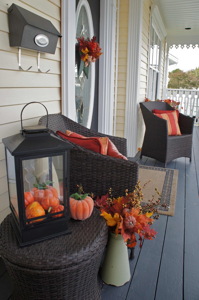 Faux pumpkins and bright faux fall leaves would last throughout the season without any maintenance.