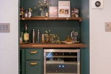 a built-in home bar with an open shelf, drawers and a fridge plus some greenery is a chic idea