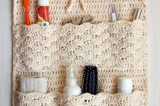a cool crocheted bathroom organizer is a cool idea – such pockets can be DIYed to organize your bathroom a bit