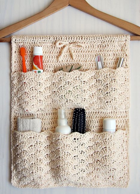 A cool crocheted bathroom organizer is a cool idea   such pockets can be DIYed to organize your bathroom a bit