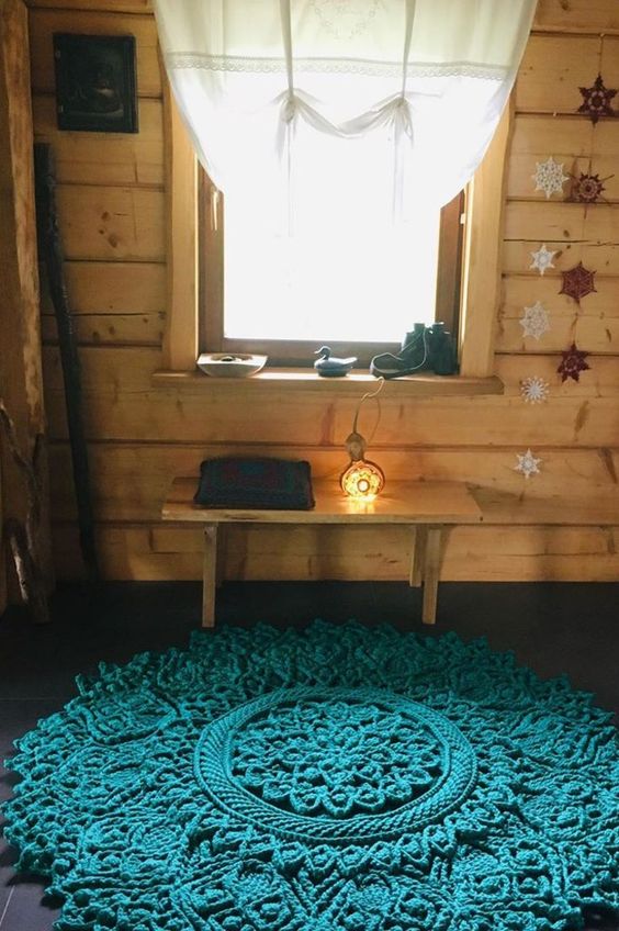 a fantastic turquoise crocheted rug with plenty of pattern is a gorgeous solution for a boho space