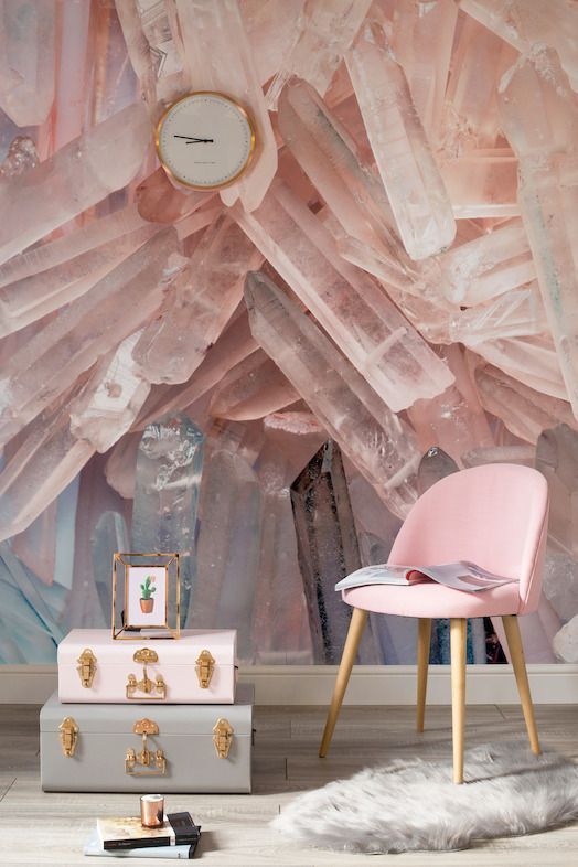 a gorgeous crystal wlal mural in pink matches the pink chair and suitcase and brings an edgy feel to the space