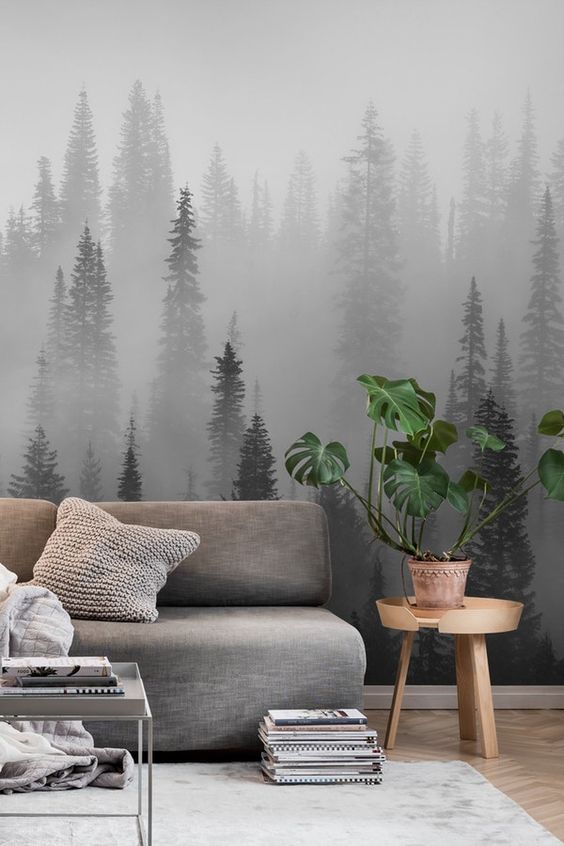 A moody forest wall mural harmonizes the space and makes it more relaxing yet very eye catching at the same time