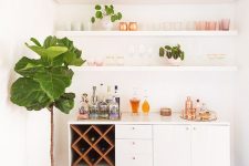 a pretty mid-century modern home bar with open shelves, a chic credenza with a storage compartment with wine bottles, potted greenery