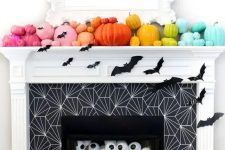 a cute pumpkin arrangement on a mantel