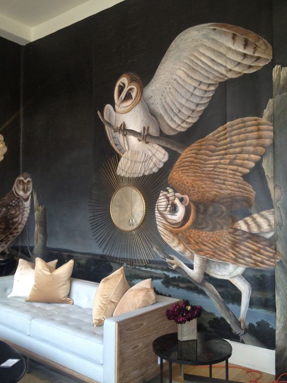 a refined living room with a unique owl wall mural that makes the space feel artsy and very unique