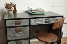 a small vintage industrial desk of metal and a stool of leather and metal is a lovely idea for vintage lovers