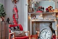 a whimsical Christmas space in red and grey, with pillar candles, lights, an advent calendar, gift boxes, an oversized watch and evergreens