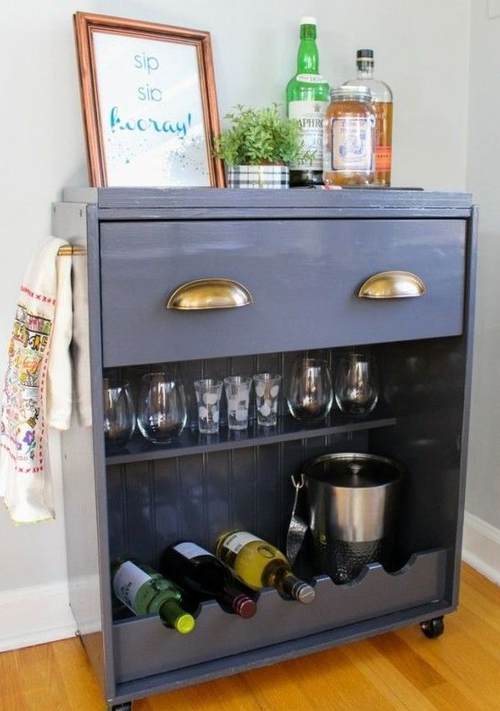 an IKEA Rast dresser turned into a stylish home bar on casters with a drawer and an open storage compartment