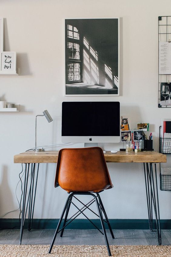 An industrial home office with a stylish desk   with hairpin legs and a wooden desktop is a cool idea for many home offices