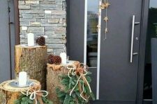 tree stumps with pinecones, fir hangings, candles and a pinecones hanging with stars, ribbons and bows for a rustic feel