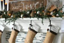 a mantel decorated for Christmas in rustic style