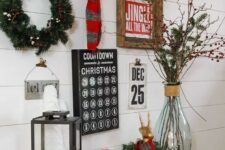 a bright gallery wall with an advent calendar, signs, metal letters and a wreath to count down to Christmas
