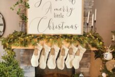 a cool calligraphy Christmas sign with a light-stained frame is a lovely idea for both indoors and outdoors