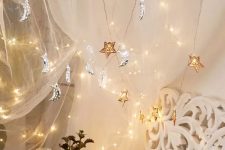 a gorgeous celestial moon and star-shaped string garland will beautifully accent your bedroom and make it nice