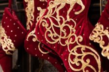deep red and gold stockings with deer appliques and rhinestones are amazing for Christmas decor