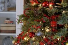 gold bells, red ornaments, plaid ribbons and red berries for Christmas tree decor