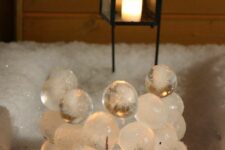 ice ball wall with a candle behind it is a lovely idea to style your backyard, looks unusual and will add a warm glow