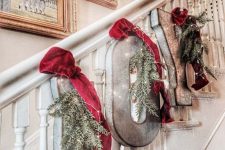 metal letters with evergreens, lights and red velvet ribbon is beautiful rustic decor for Christmas