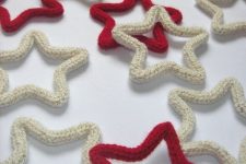 white and red stars covered with knits are great for creating a holiday feel in the space and will catch an eye for sure