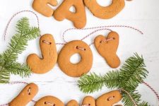 a pretty Christmas banner made of gingerbread letters and evergreens is a perfect decoration for your Christmas tree or some other place