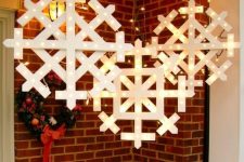 marquee snowflakes hanging over the porch or in your garden will bring a strong festive feel to the space and will make it Christmassy