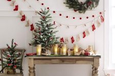 pretty Christmas garlands of red and white sotckings, pompoms and other stuff are great for Christmas decor