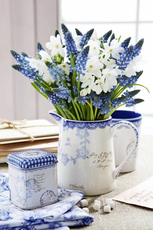 a jug with white crocus and blue hyacinths is a lovely and fresh spring flower arrangement is a beautiful idea