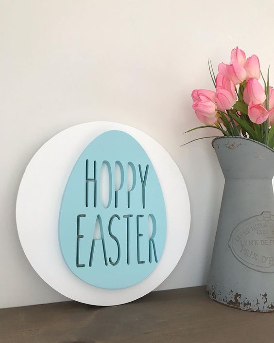 A modern and creative spring sign   a white circle with a blue Easter egg is a lovely and fun idea to rock