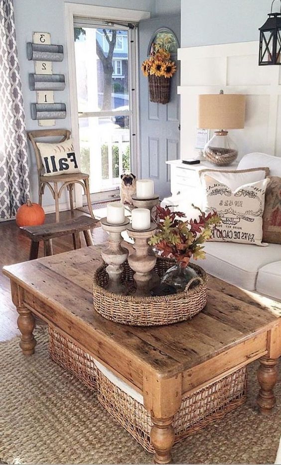 a rustic wooden coffee table with woven baskets for storing smaller things