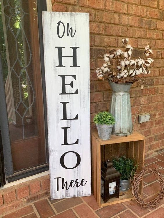 a shabby chic wooden plaque sign done with paint and stencils is a lovely idea for a rustic space